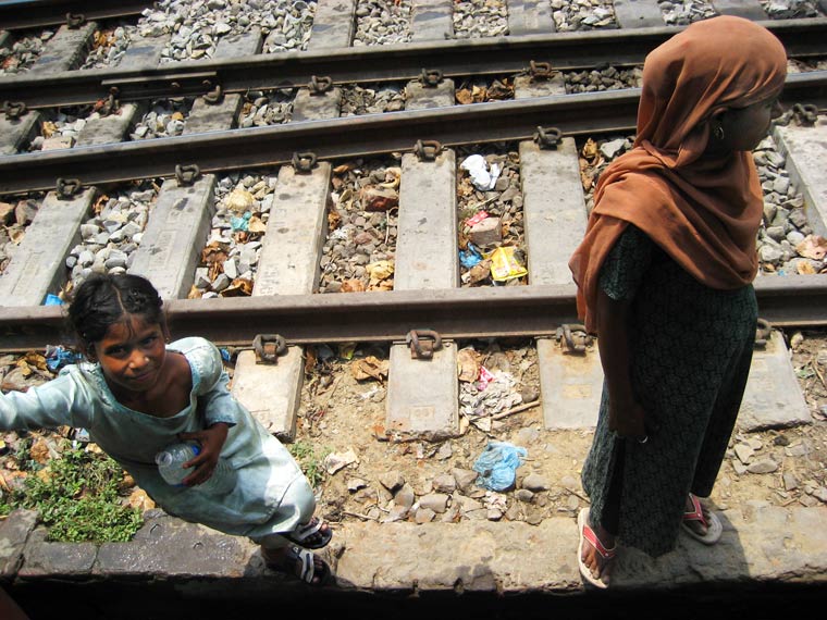 Mother and daughter begging on the railway Kolkata, India